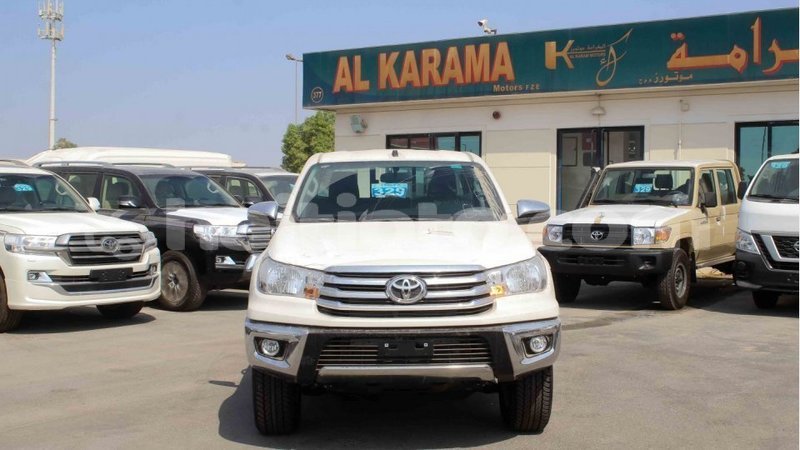 Big with watermark toyota hilux artibonite import dubai 2040